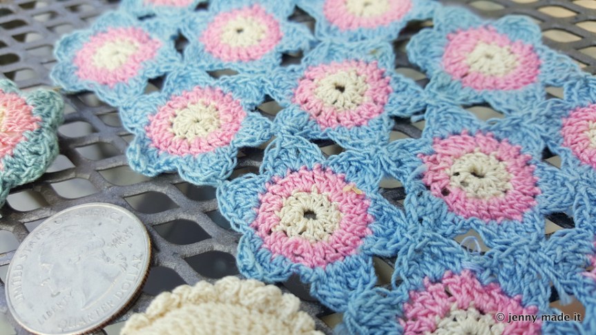 close up mini crocheted blanket and pillows