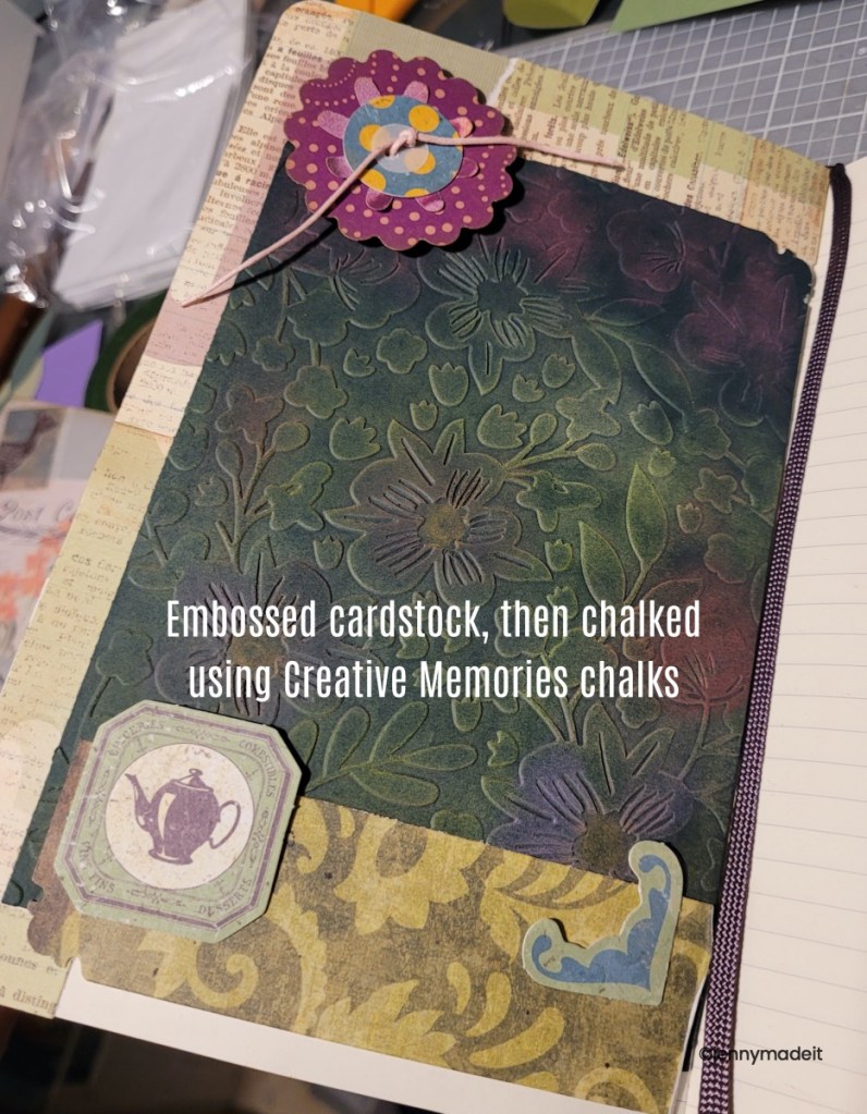 Photo of a page from my own junk journal featuring embossed card stock.